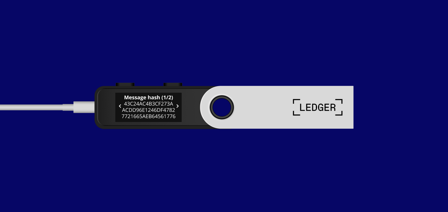 Ledger hardware wallet displaying a message for the user to review and confirm before signing.